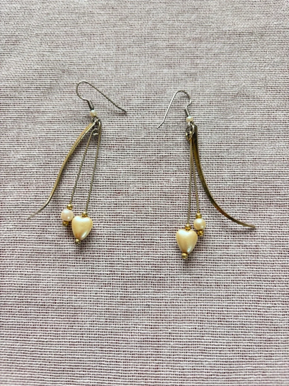 Set of three vintage cream earrings.